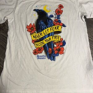 Beautiful Disaster White Graphic Tee with Blue Raven & Red Floral Design